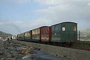 Quarrymen’s carriages at the top end of ‘Prince’s train as it runs back along the Cob.       (15/10/2005)