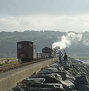The mixed train runs away into the distance along the Cob.       (15/10/2005)