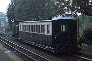 ‘Moelwyn’ and carriage 15 depart from Minffordd on the way back to Boston Lodge.       (15/10/2005)