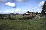 The stock for the gravity train runs along Gwyndy Bank behind the morning up train   (03/05/1993)