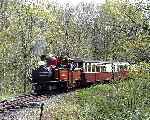 ‘David Lloyd George’ runs off Creuau bank into Tanybwlch station with a down train.   (01/05/2004)