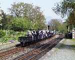 A well populated gravity train rolls into the loop at Minffordd.   (01/05/2004)
