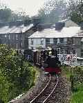 The mixed train runs across the road at Penrhyn with ‘Linda’ in charge.   (02/05/2004)