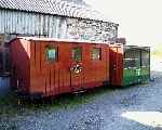 Quarrymans' Carriage No. 8 and the Small Birmingham ‘Zoo Car’ outisde the old engine shed, Boston Lodge.   (03/05/2004)