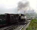 Heading out along the Cob, ‘Earl of Merioneth’ departs from Porthmadog.   (03/05/2004)