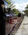 ‘Linda’ runs into Minffordd with a down train as ‘Taliesin’ waits in the up loop.   (03/05/2004)