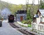 ‘Taliesin’ leaves it's carriages and takes water at Tanybwlch.   (03/05/2004)