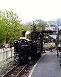 ‘Taliesin’ runs along the up platform after taking water and running round, Tanybwlch.   (03/05/2004)