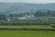 Viewed from the WHR train - ‘Merddin Emrys’ approaches Lottie’s Crossing on the other side of the valley       (07/05/2007)