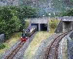 ‘Blanche’ emerges from under the main road at Blaenau and runs towards the terminus alongside the standard gauge line from Llandudno Junction   (18/09/2000)