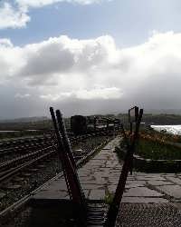The Talking Train runs out along the Cob at Porthmadog.   (03/05/2004)
