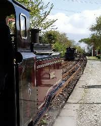 Passing trains - ‘Taliesin’ waits for an arriving train at Minffordd station.   (03/05/2004)