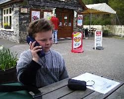 James listens to another story on his Talking Train handset.   (03/05/2004)
