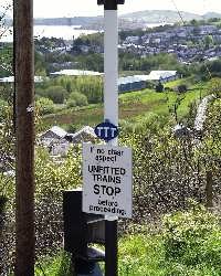The TTT (Talking Train Toot) sign above Penrhyn Crossing, time for the passengers to select another tale.   (03/05/2004)