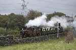 ‘David Lloyd George’ with a 1950s train departs from Minffordd for Porthmadog.   (25/09/2004)