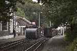 The Flying Flea departs from Minffordd as the Simplex stands in the up platform.   (26/09/2004)