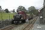 ‘David Lloyd George’ runs along the main line approaching Minffordd with a coal train for the exchange sidings.   (26/09/2004)