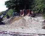 The sand so carefully loaded into the Hudson skips is now tipped back onto the pile!   (07/09/2003)
