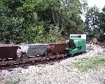A rake of skips is pushed into the yard by 20hp Simplex ‘Damredub’    (07/09/2003)