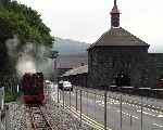 ‘Elidir’ passes the quarry workshops at Gilfach Ddu with a train approaching from the new extension.   (06/08/2003)