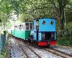 Running back into Cei Llydan, ‘Thomas Bach’ arrives with a train for Llanberis.   (06/08/2003)
