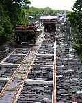 Slate wagons pass on the restored Vivian incline.   (06/08/2003)