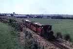 ‘Douglas’ approaches Ty Mawr with an up train, Tywyn can be seen in the distance   (02/08/1981)