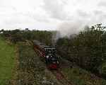 No 1 ‘Talyllyn’ approaches Ty Mawr bridge with the up ‘Quarryman’ service.   (29/09/2003)