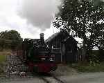 After taking the Brynglas to Quarry Siding token, ‘Talyllyn’ pulls away from Brynglas over the level crossing.   (29/09/2003)