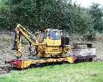 An impressive piece of machinery, the John Bate designed flail mower stands in the siding at Brynglas.   (29/09/2003)