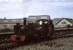 Vale of Rheidol No 7 ‘Owain Glyndwr’ runs light from the sheds towards Aberystwyth station.   (01/09/1990)