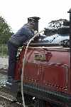 ‘Fill her up please!’ - Chris Jones waters his steed at the platform end, Dinas.   (11/09/2004)
