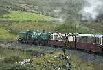 138 rolls down round the curves at Ffridd Isaf with a down train.   (11/09/2004)