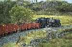 143 at the head of the mixed train runs around Ffridd Isaf curves.   (11/09/2004)