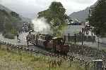 Just the hint of sunshine as ‘Prince’ departs from Waunfawr with the shuttle train and ‘Conway Castle’.   (12/09/2004)
