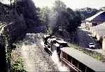 138 storms up the grade out of Caernarfon with reopening train   (13/10/1997)