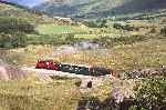 Looking down the valley towards Llyn Cwellyn, ‘Prince’ and the vintage train in the between the rocks near Rhyd Ddu   (27/09/2003)