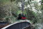 Garratt 138 ‘Millennium’ emerges from the bends at Plas-y-nant, approaching the river crossing   (27/09/2003)