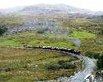 143 and train are dwarfed by the looming mass of Snowdon above them, Ffridd Isaf   (27/09/2003)
