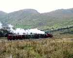 Rolling down the hill from Rhyd Ddu, the line follows the far side of the valley in the distance   (27/09/2003)