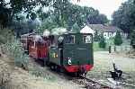 832 (Countess) runs across the level crossing into Castle Caereinion station with a train from Llanfair   (01/09/1995)